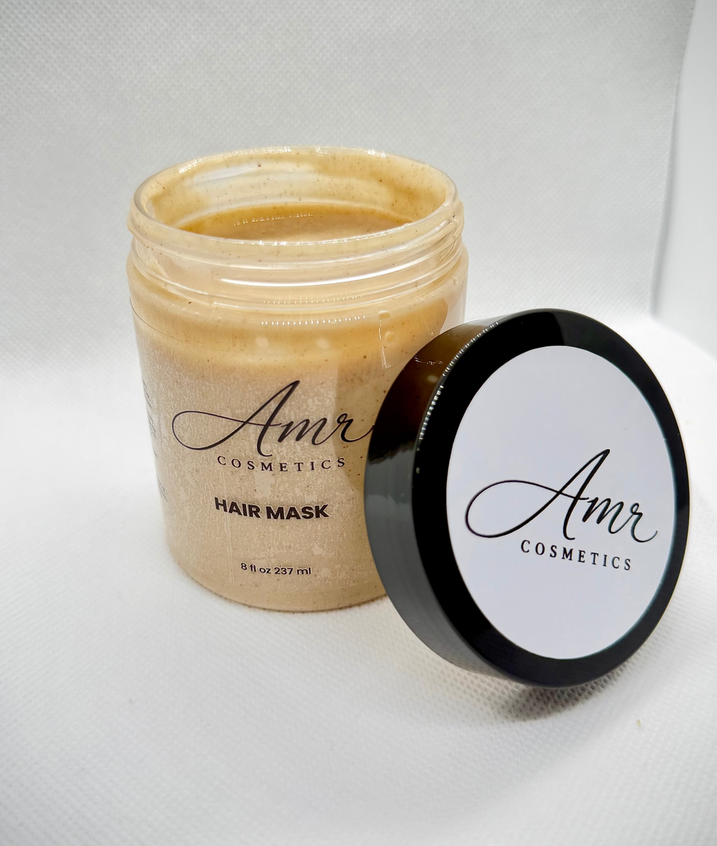 Amr Cosmetics hair mask jar with black lid on a white background